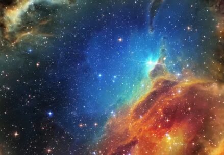 Colorful star-forming nebula with bright stars scattered across a dark space background