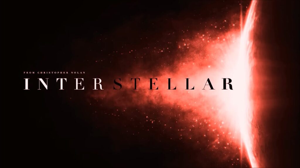 The title "Interstellar" over a bright cosmic anomaly on a dark background