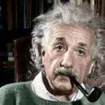 Albert Einstein with a pipe in his mouth