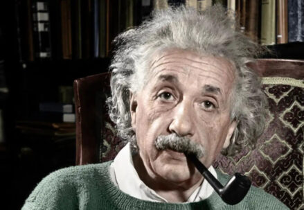 Albert Einstein with a pipe in his mouth