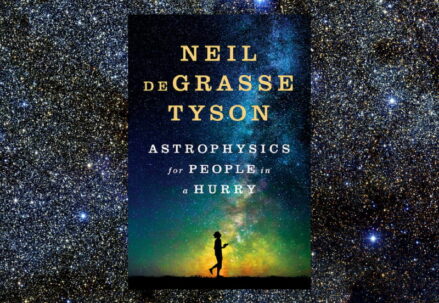 A book on astrophysics against the backdrop of a starry sky
